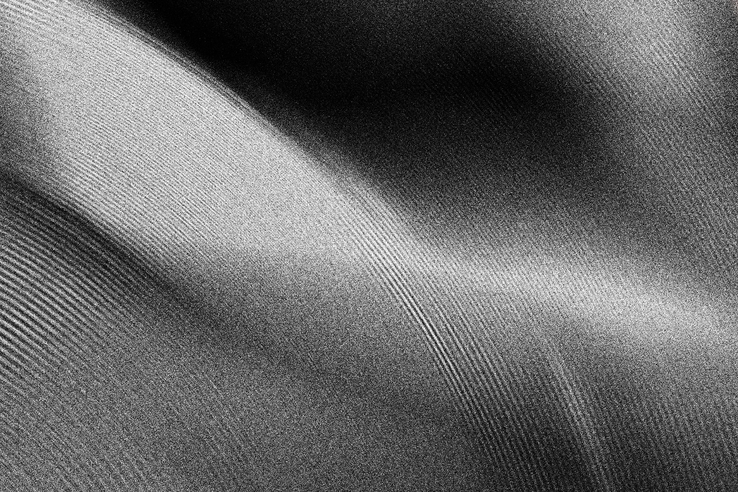 Abstract black and white artwork with layered, curving folds and a fine grain texture.